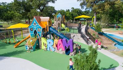 Sprawling inclusive playground; Frank Kent's Dream Park in Fort Worth, TX offers an  inclusive playground with a concrete-sculpted DREAM climber centerpiece. A hot air balloon-themed play space for ages 2 to 5. As well as a Double ZipKrooz®, We-saw™, playground swings, and net climbers.