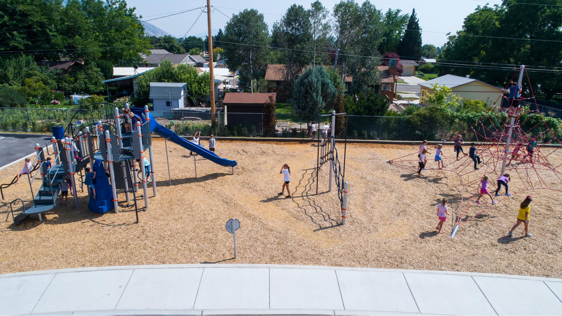 Edgemont Elementary School in Provo, UT features GeoPlex® 3-Spoke Tower with Cables to the SwiggleKnots™ and Double Swoosh Slide® and SpyroSlide™.