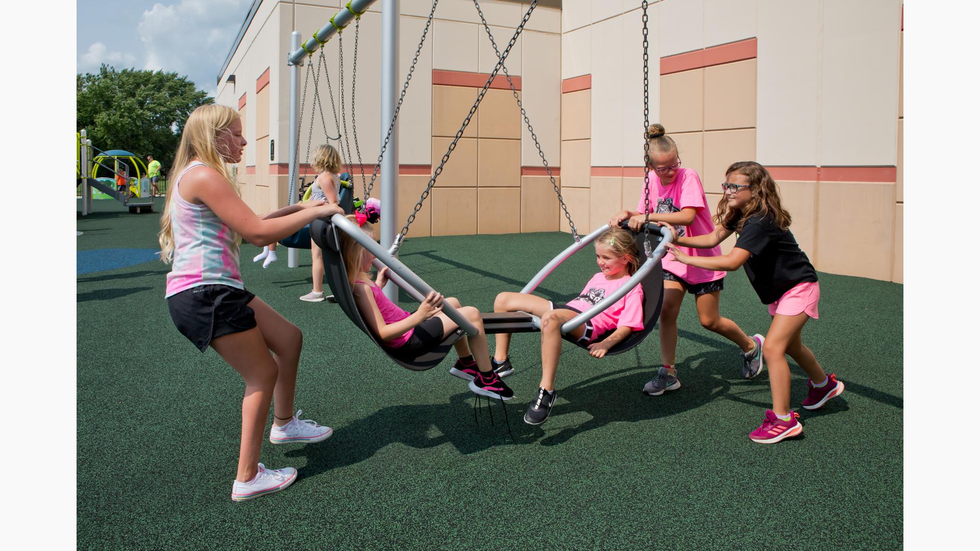 Grils playing on We-Go-Round® with DigiFuse® Panels