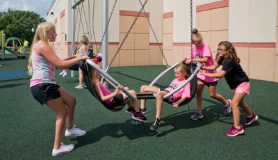 Grils playing on We-Go-Round® with DigiFuse® Panels