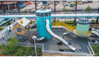 Domino Park in Brooklyn, NY features colorful play elements inspired by historic sugar factory inspired by artist Mark Reigelman.