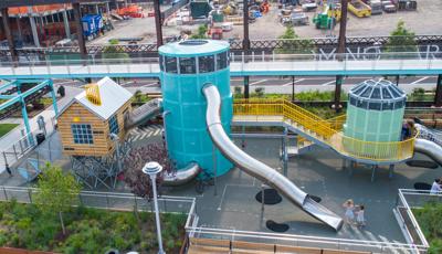 Domino Park in Brooklyn, NY features colorful play elements inspired by historic sugar factory inspired by artist Mark Reigelman.