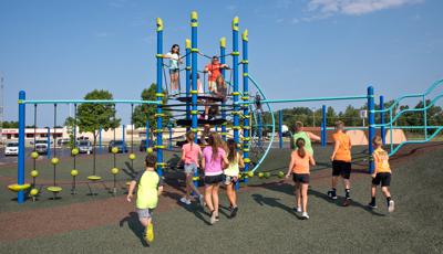 Kids playing around Netplex® play structure