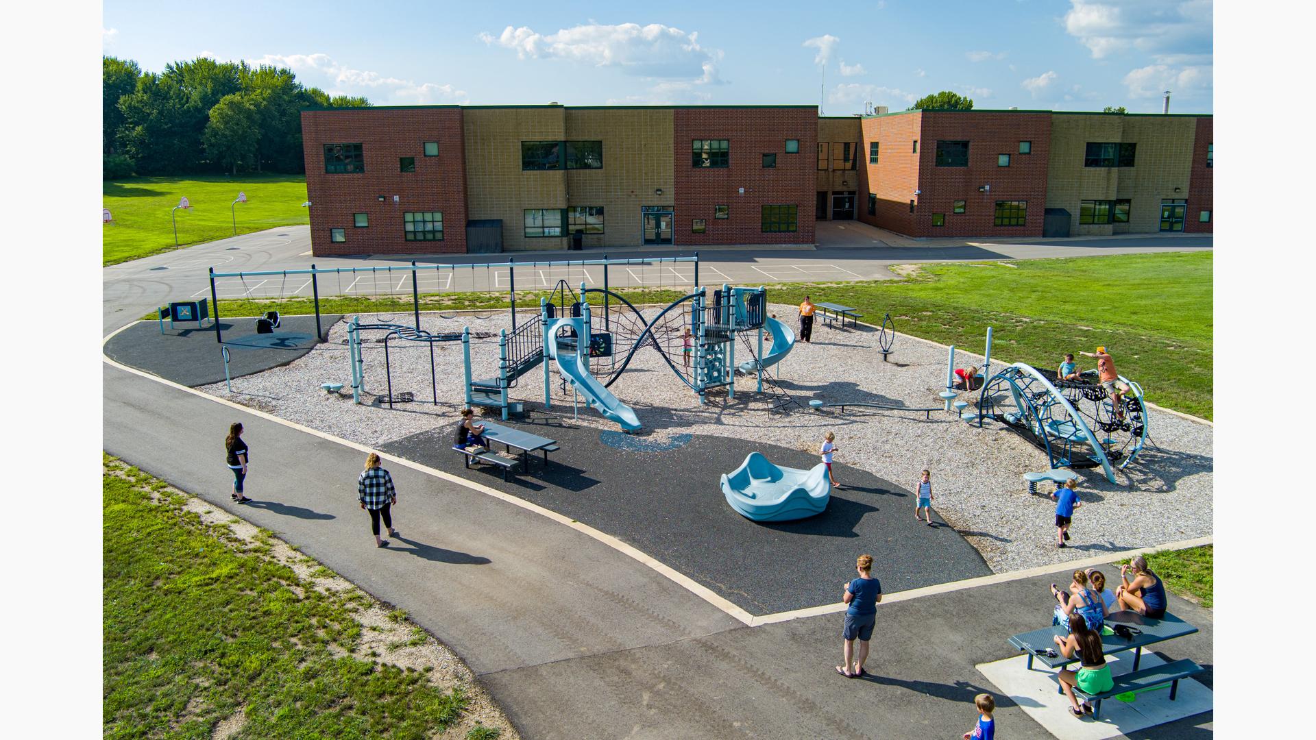 Elevated view of children playing on a school playground.