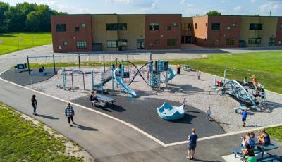 Elevated view of children playing on a school playground.