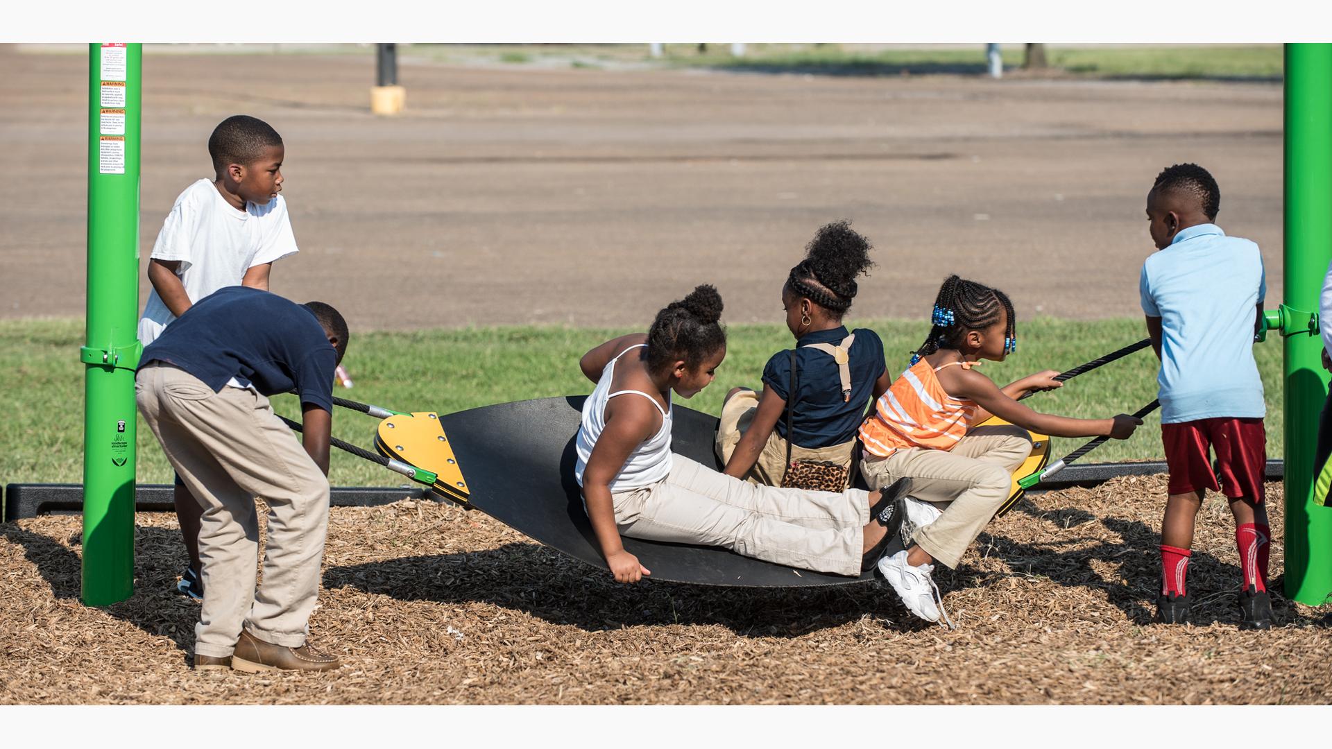 Children playing on Boogie board