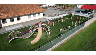 Elevated view of a school playground filled with playing children.