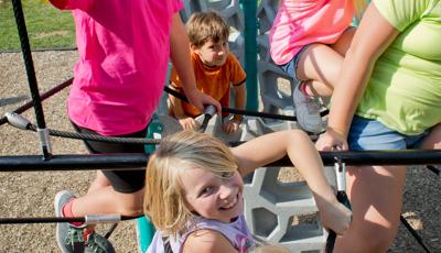 Kids having fun and smiling on Netplex Climber