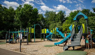 Kids playing on play structures at Basswood Park Maple Grove, MN