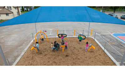 Freestanding Rhapsody Outdoor Musical Instruments for Ages 2 to 5 under SkyWays shade canopy.