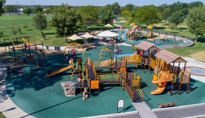 Aerial view of inclusive nature-inspired and farm-themed playground with accessible ramps. 