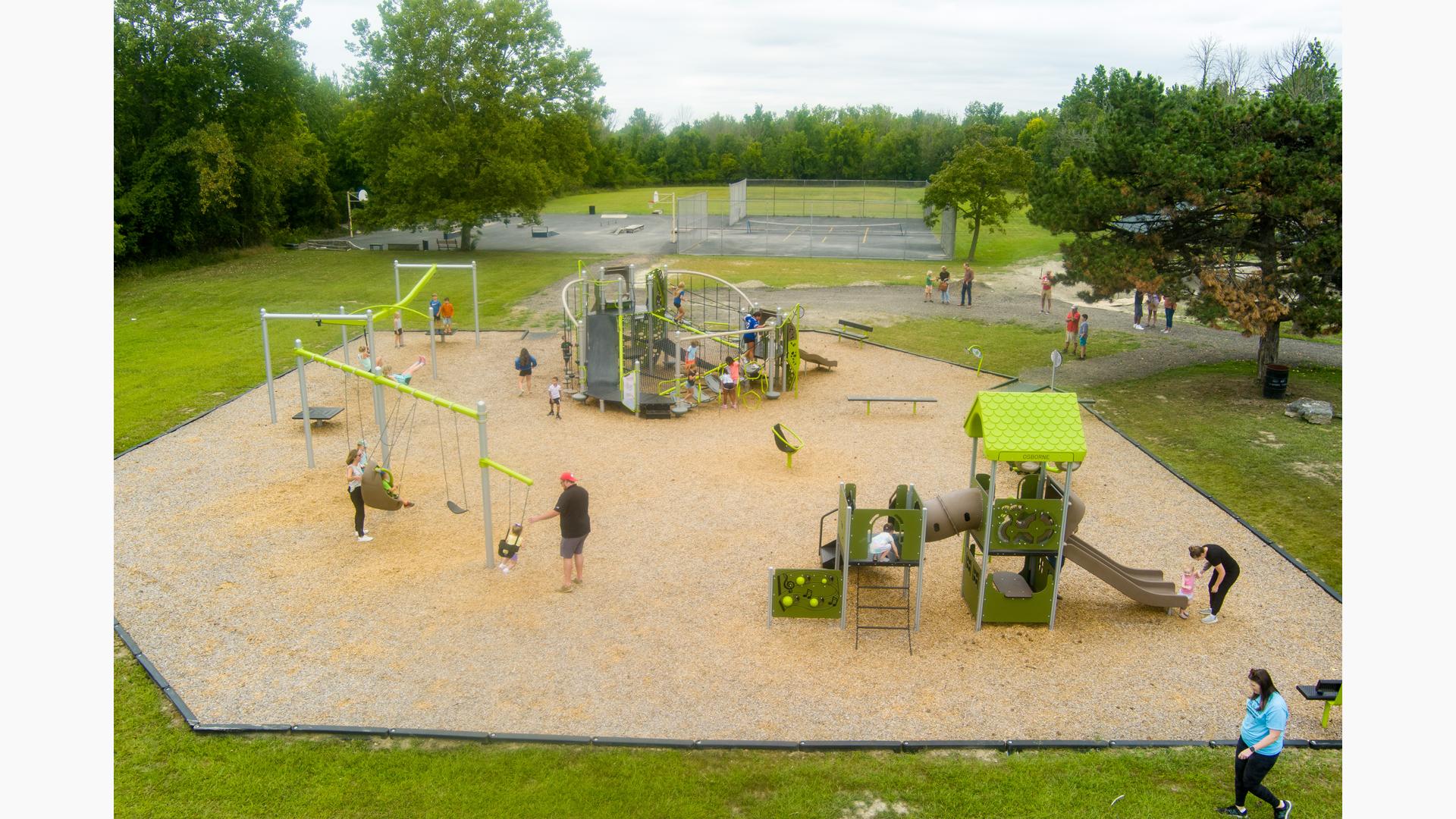 Elevated view of a city park filled with playing children.