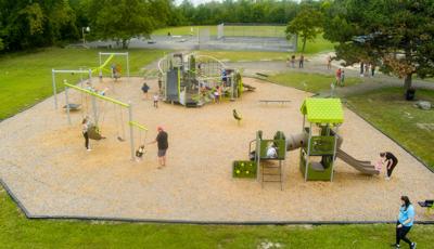 Elevated view of a city park filled with playing children.