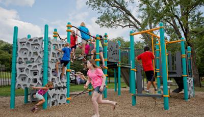 Children playing on main play structure at Baden Academy Charter School