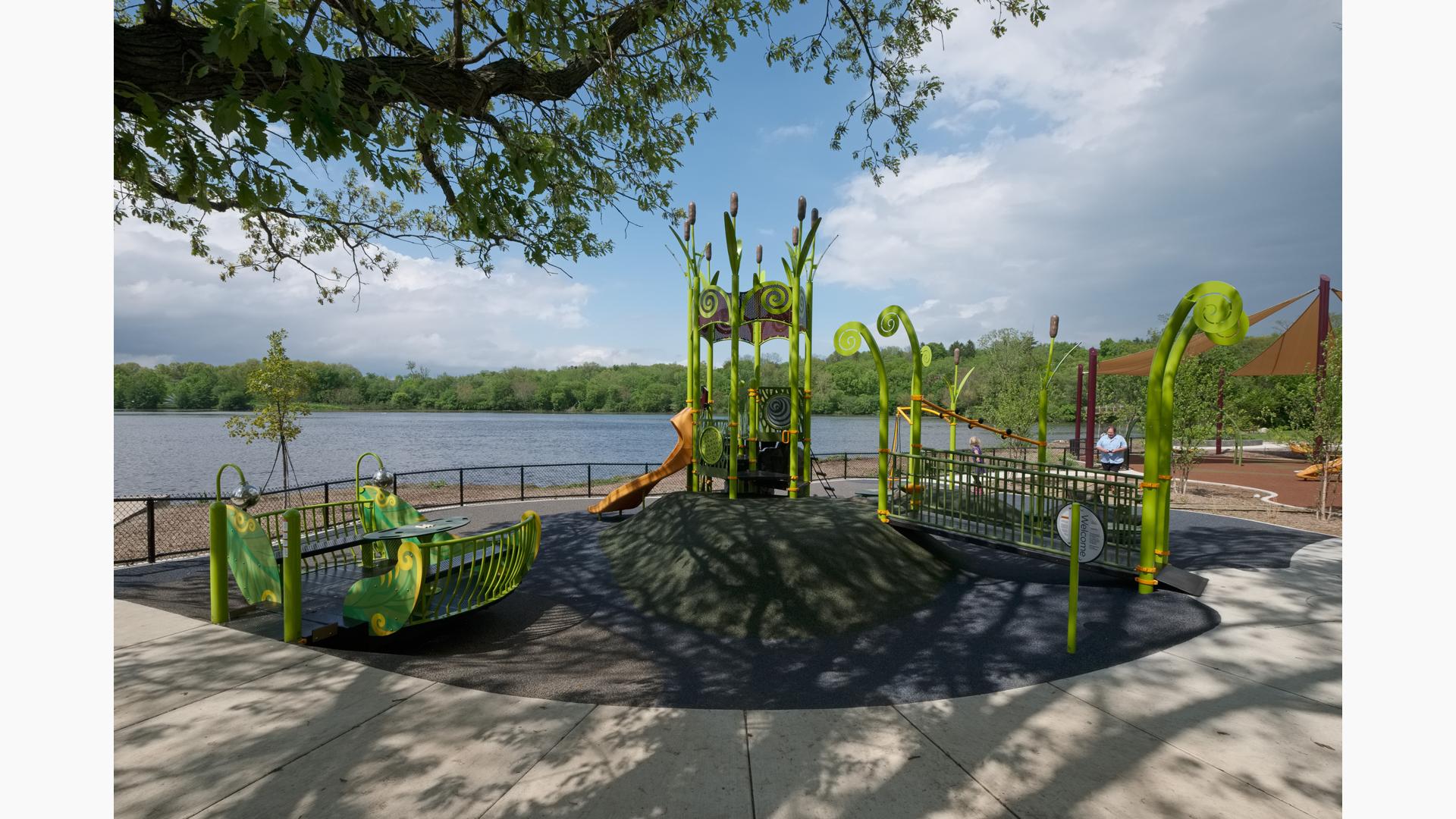 Located along with Huron River, the Gallup Park Rotary Playground a PlayBooster® play structure. A tower play structure mimicking a birds nest for ages 5 to 12. It also features a custom Sway Fun® Glider and concrete-sculpted animals, as well as SkyWays® shade products.