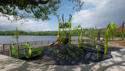 Located along with Huron River, the Gallup Park Rotary Playground a PlayBooster® play structure. A tower play structure mimicking a birds nest for ages 5 to 12. It also features a custom Sway Fun® Glider and concrete-sculpted animals, as well as SkyWays® shade products.